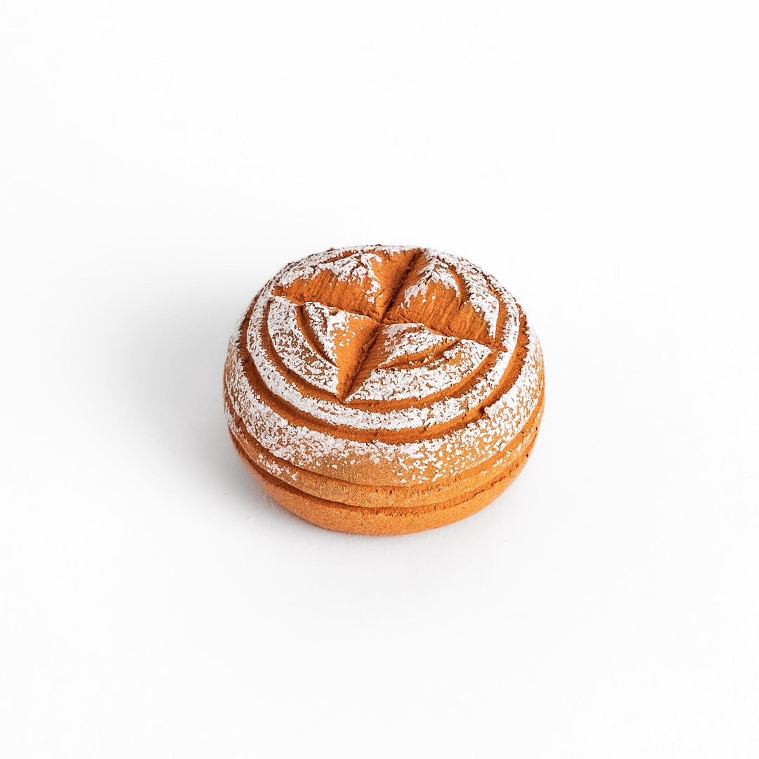 Charming chopstick rest shaped like a round loaf of country-style bread, dusted with flour for a realistic and cozy touch.