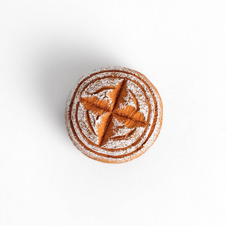 Charming chopstick rest shaped like a round loaf of country-style bread, dusted with flour for a realistic and cozy touch.