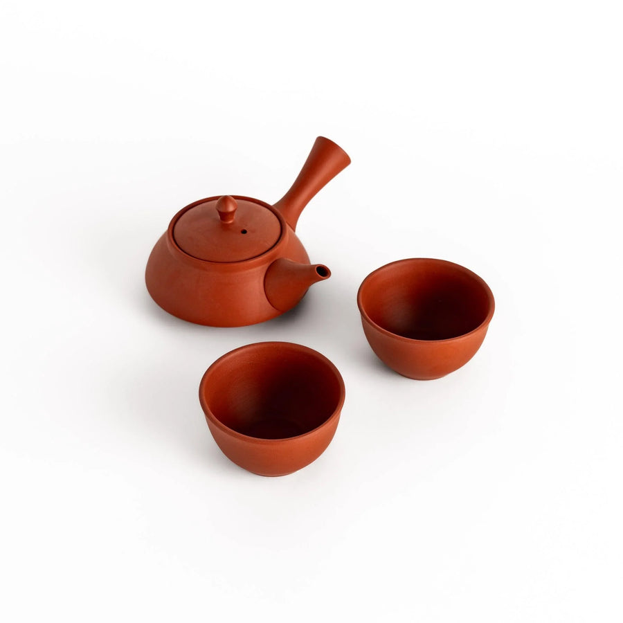 Crimson tea set with round teapot and bowls offering simple style for everyday tea moments.