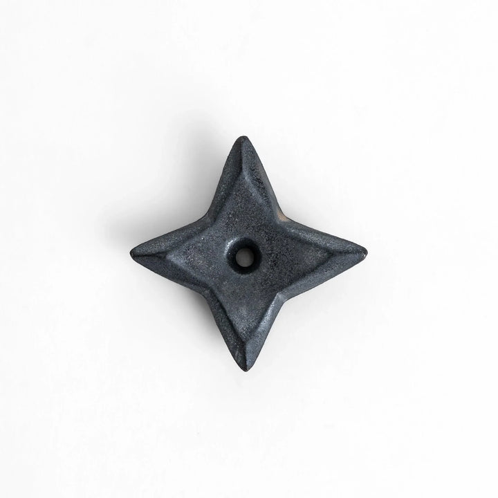 Ninja star shaped chopstick rest with metallic finish adding playful and stylish accent to Japanese dining.