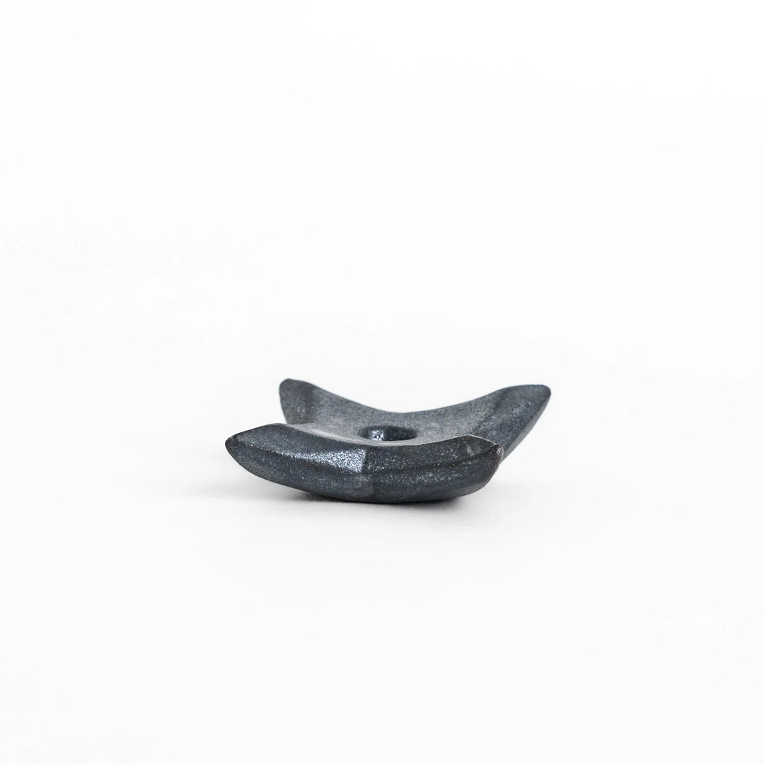 Ninja star shaped chopstick rest with metallic finish adding playful and stylish accent to Japanese dining.