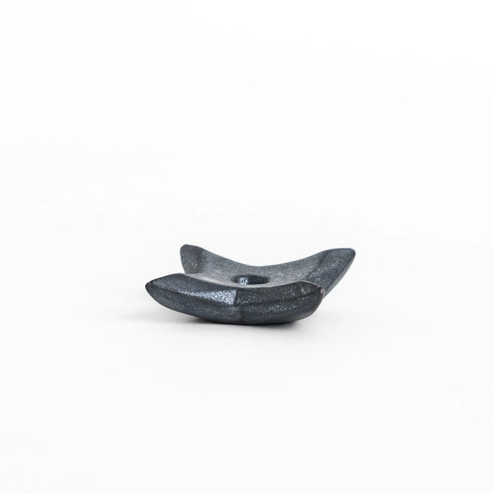 Ninja star shaped chopstick rest with metallic finish adding playful and stylish accent to Japanese dining.