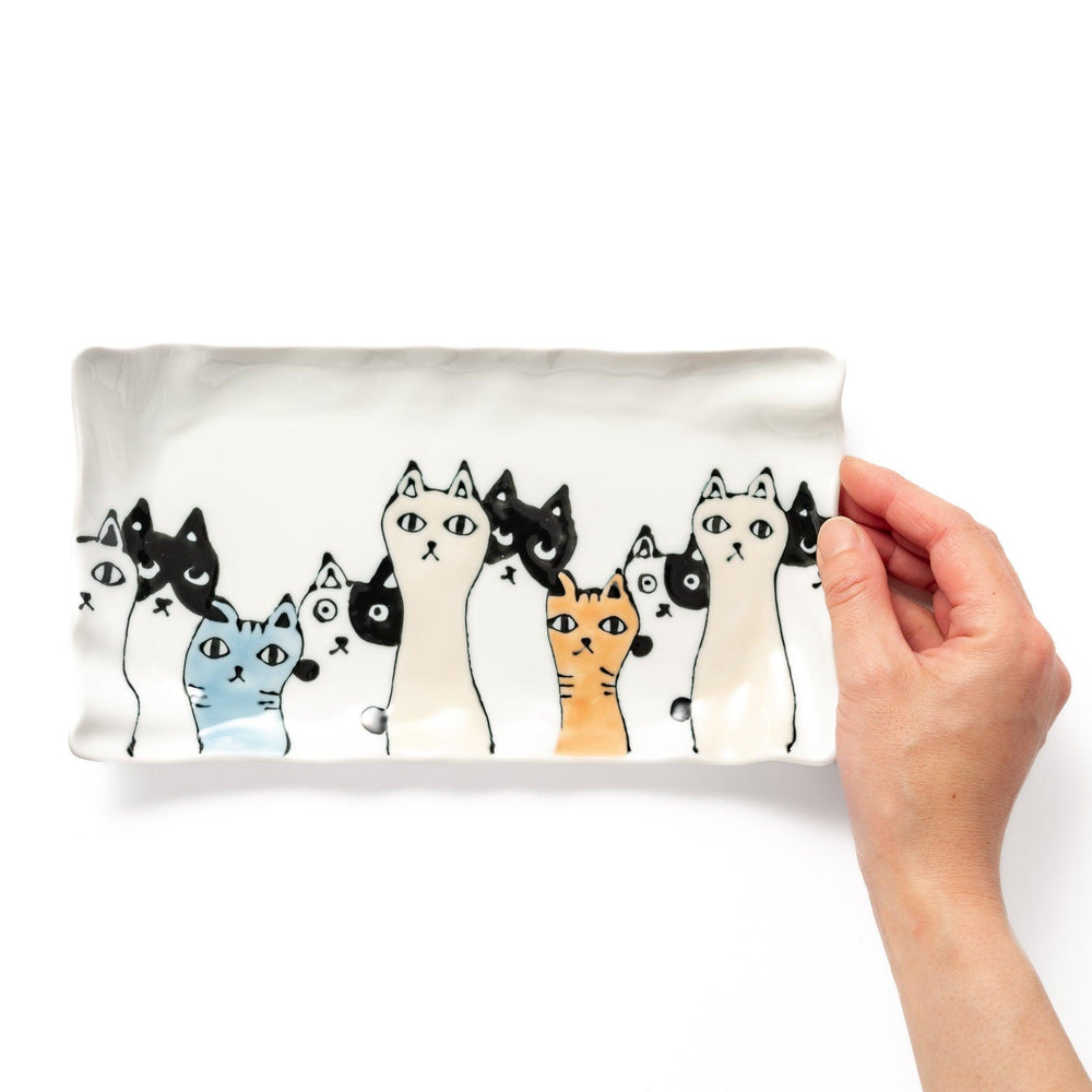 Salad plate with colorful cats in black, white, orange, and blue, wavy-edged for a whimsical table accent.