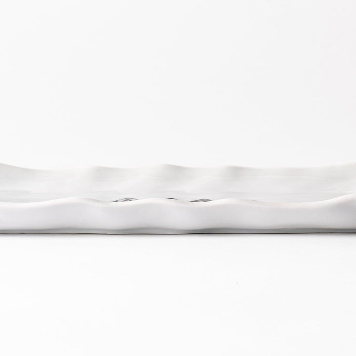 Salad plate with colorful cats in black, white, orange, and blue, wavy-edged for a whimsical table accent.