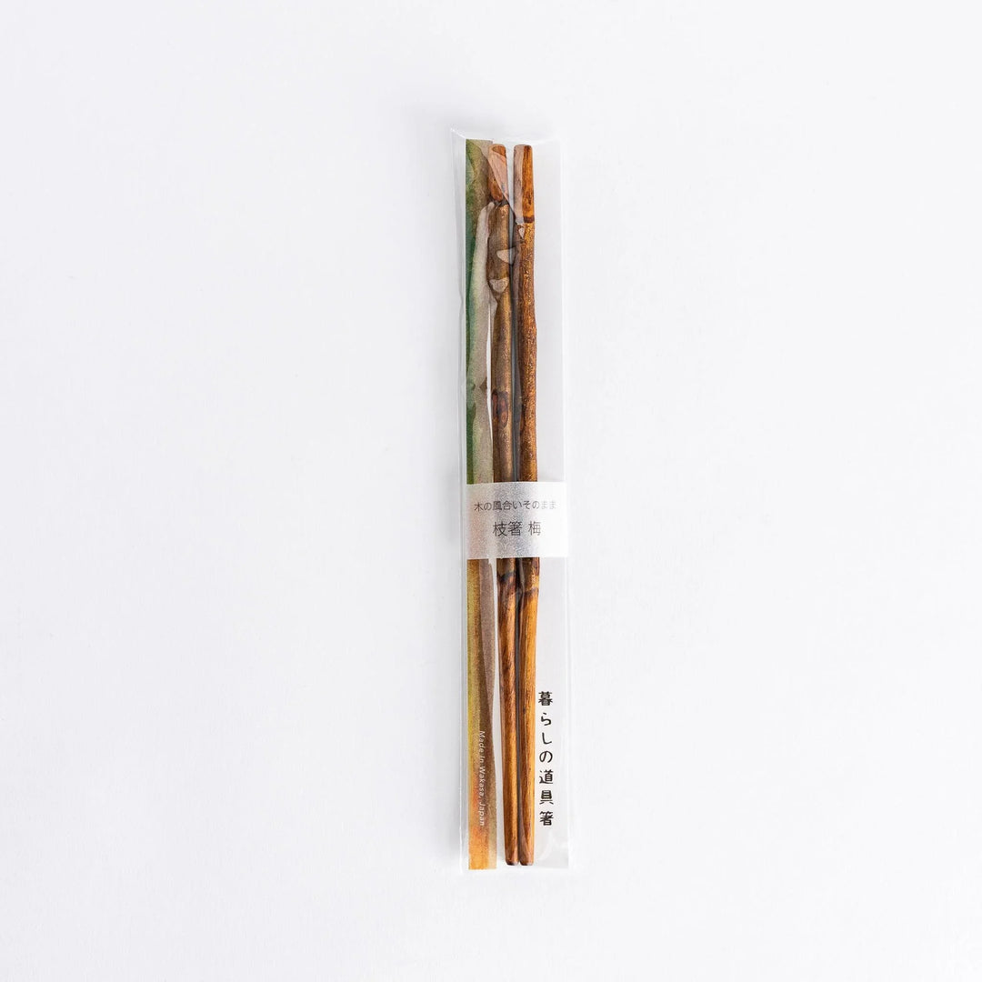 Elegant dark plum branch serving chopsticks, designed with a delicate branch motif and perfect for serving dishes in style.