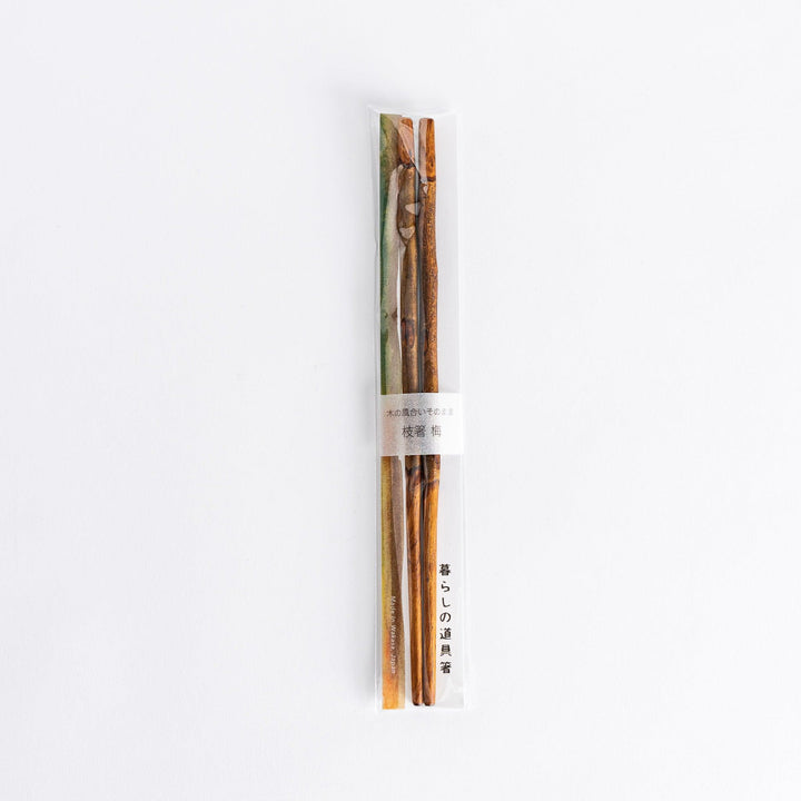 Elegant dark plum branch serving chopsticks, designed with a delicate branch motif and perfect for serving dishes in style.