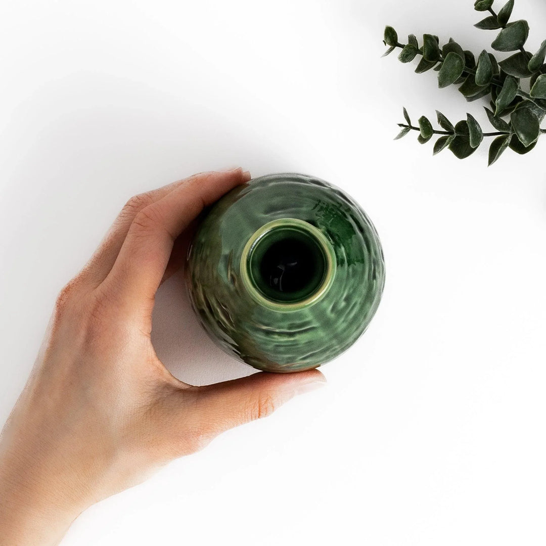 Glossy green ceramic sake flask with a textured finish and classic shape, ideal for serving warm or chilled sake.