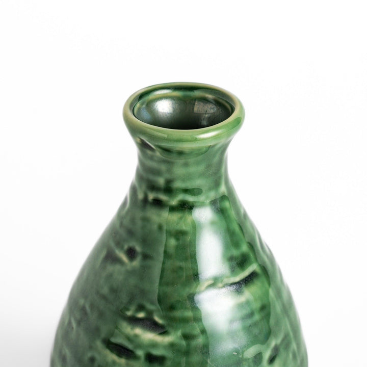 Glossy green ceramic sake flask with a textured finish and classic shape, ideal for serving warm or chilled sake.