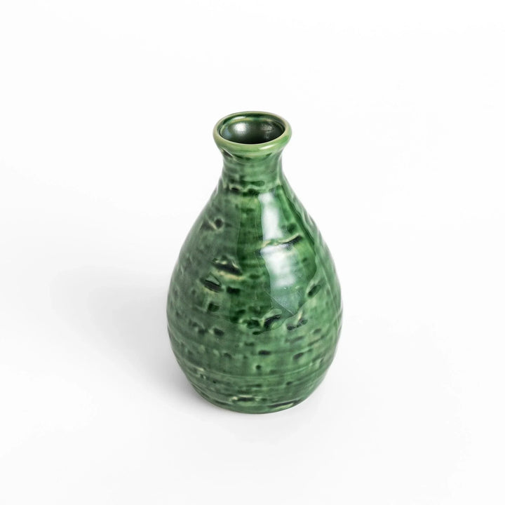 Deep green sake flask with a glossy, textured finish, crafted in a traditional style for elegant serving.