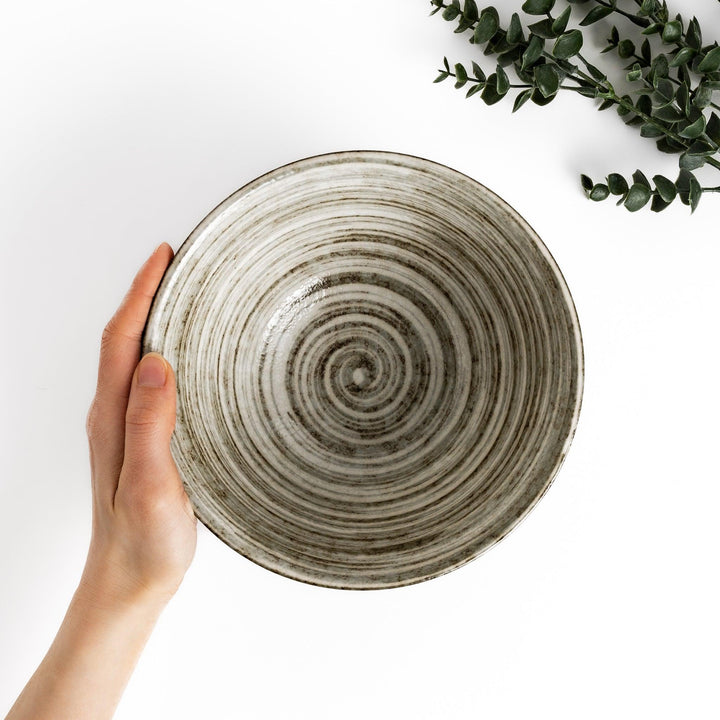 Textured ramen bowl with an earthy brown exterior, featuring a smooth white interior and a sturdy base for comfortable use.