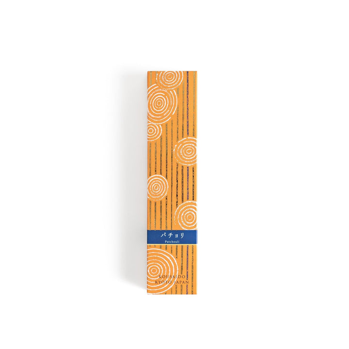 Japanese patchouli incense sticks in a wooden box with orange patterned sleeve from Kousaido Kyoto Japan.