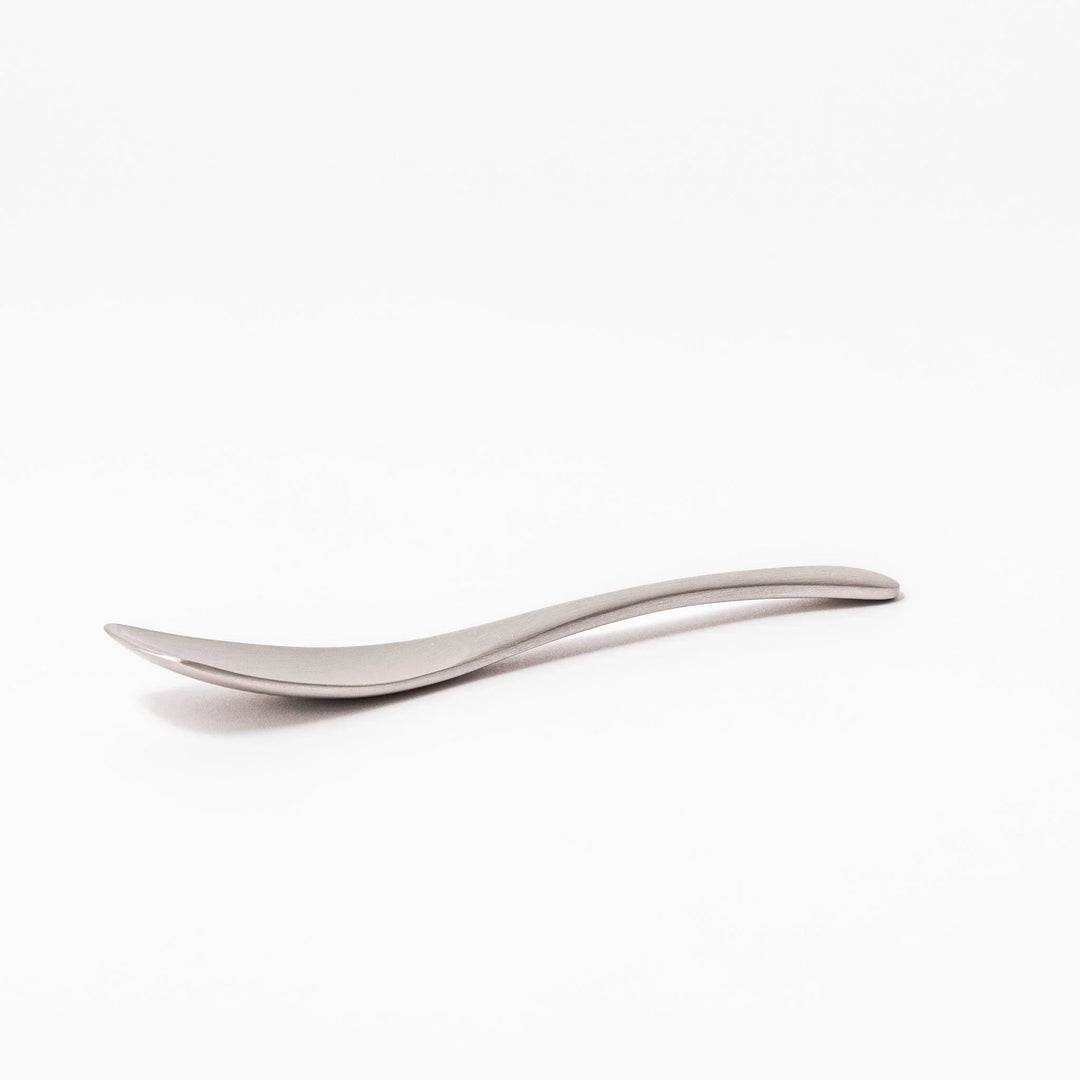 Silver aluminum ice cream spoon with satin finish and flat edge for smoothly scooping hard frozen desserts.