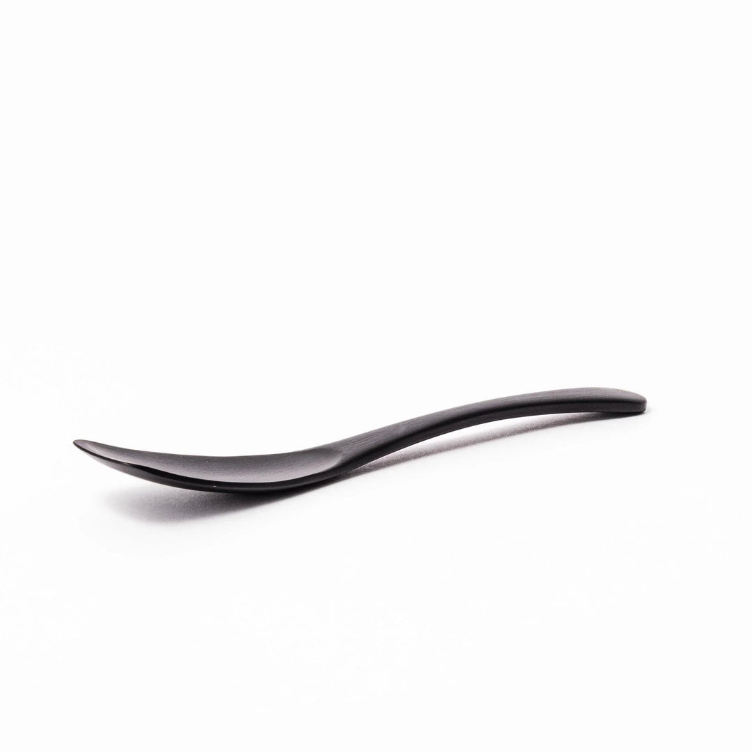 Matte black aluminum ice cream spoon with flat edge designed for easy scooping of firm frozen desserts.