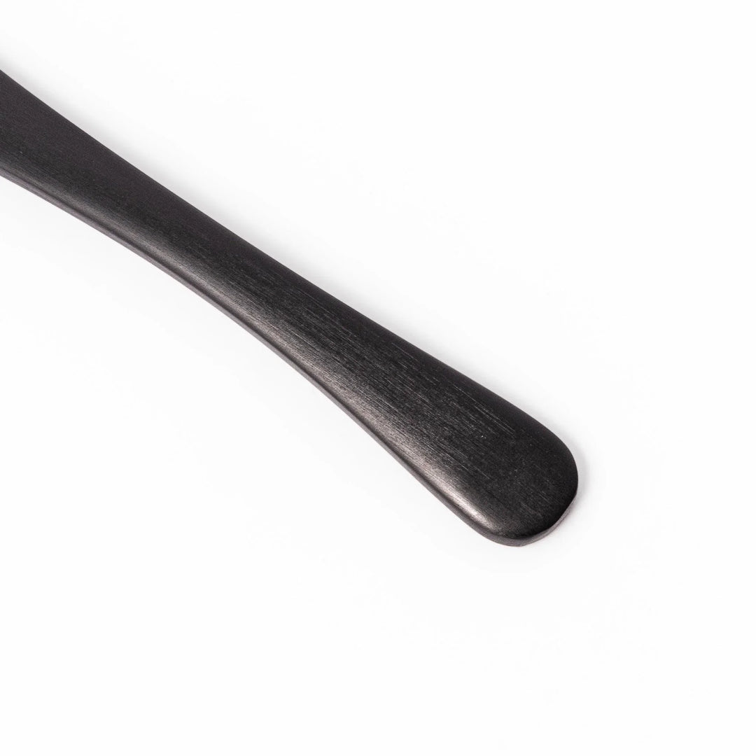 Matte black aluminum ice cream spoon with flat edge designed for easy scooping of firm frozen desserts.