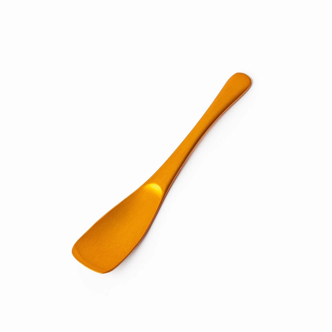 Gold aluminum ice cream spoon with matte finish and flat scoop edge designed to glide through hard ice cream.