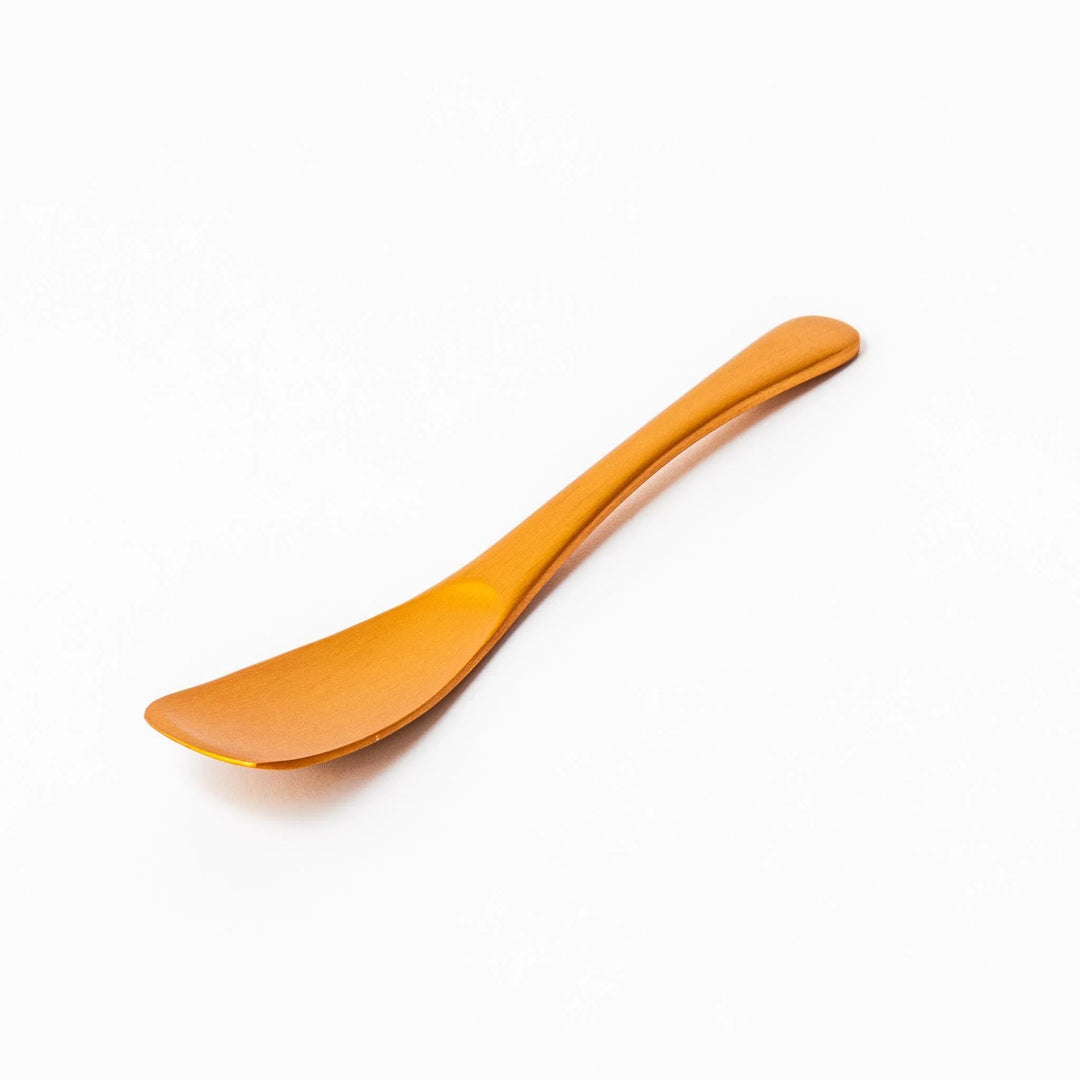 Gold aluminum ice cream spoon with matte finish and flat scoop edge designed to glide through hard ice cream.