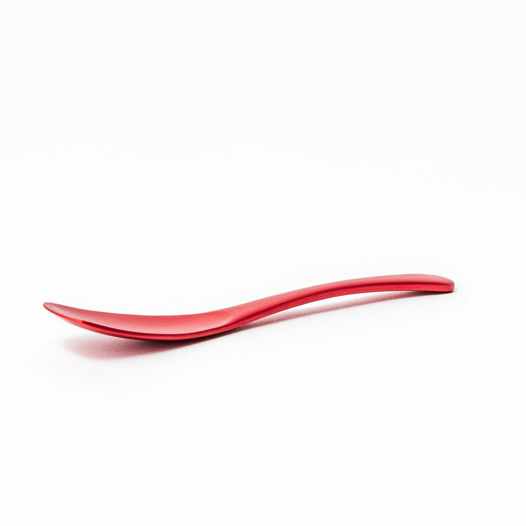 Red aluminum ice cream spoon with a flat edge and matte finish, designed to cut through hard ice cream with ease and comfort.