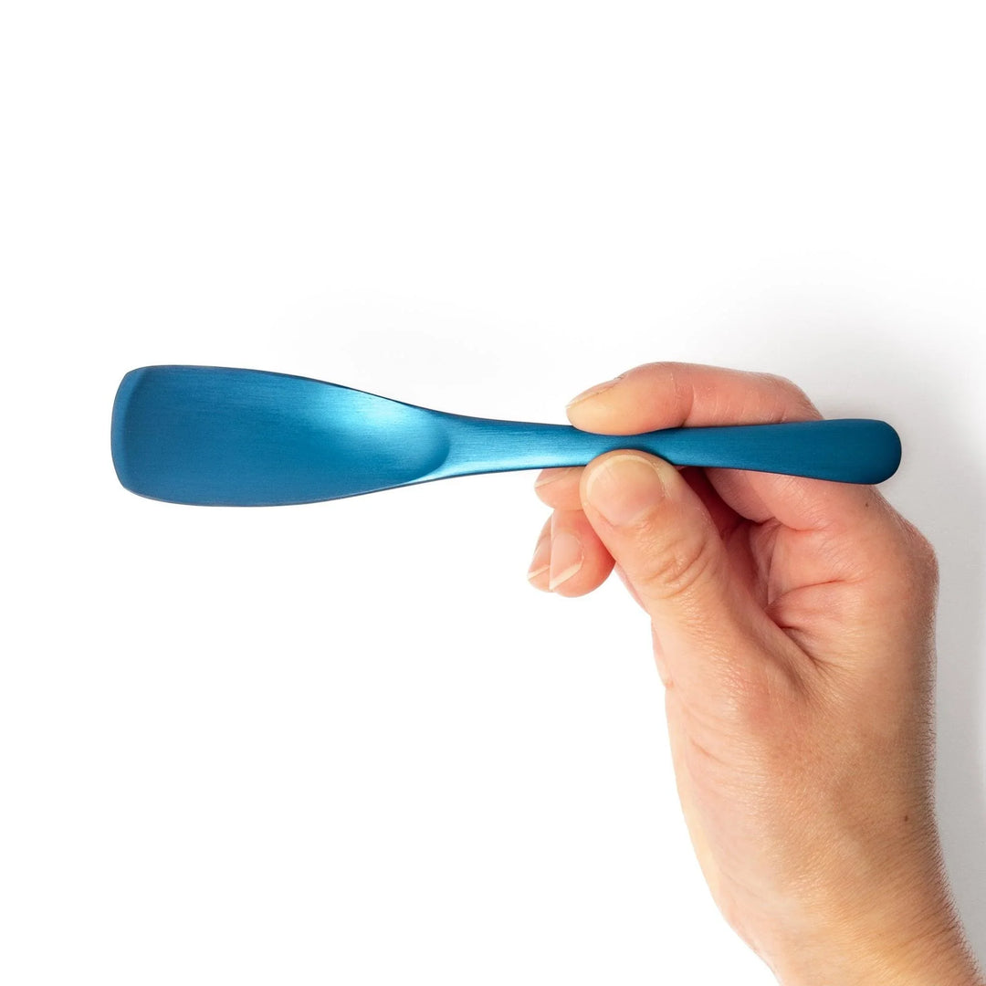 Blue aluminum ice cream spoon with matte finish and flat tip designed to scoop hard frozen desserts.