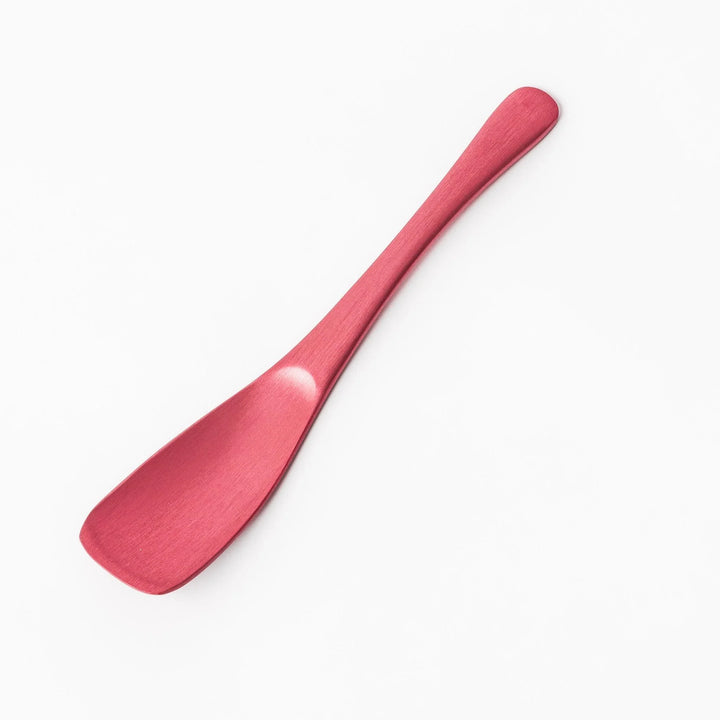 Pink aluminum ice cream spoon with ergonomic curve and matte finish, perfect for effortlessly scooping hard ice cream.