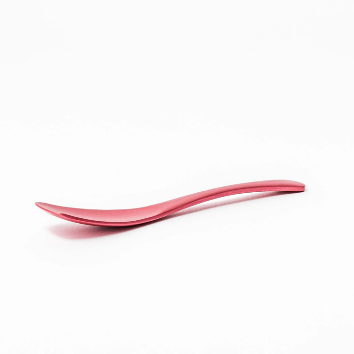 Pink aluminum ice cream spoon with ergonomic curve and matte finish, perfect for effortlessly scooping hard ice cream.