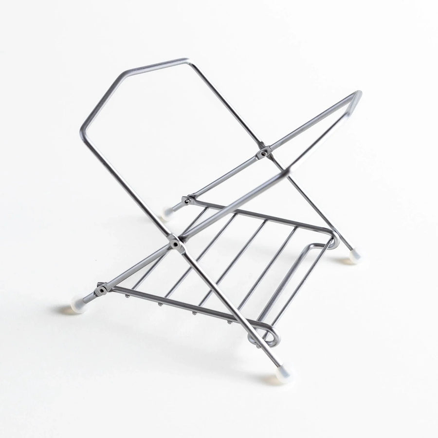 Stainless steel compost holder frame in a minimalist, compact design, ready for holding compost bags.