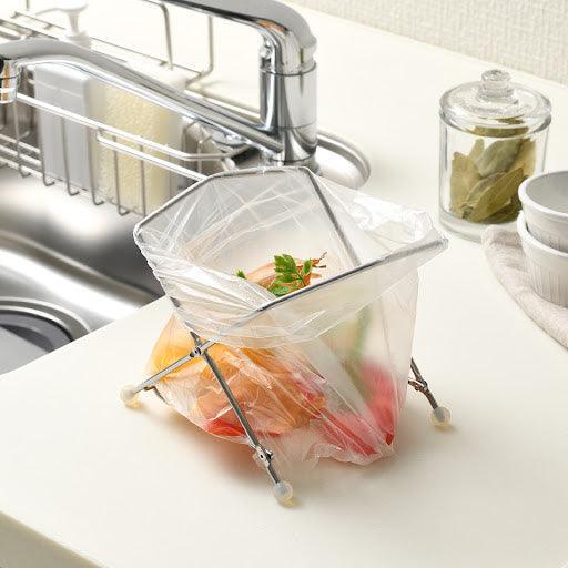 EcoFrame stainless compost holder with plastic bag inside offering compact and clean food waste solution.
