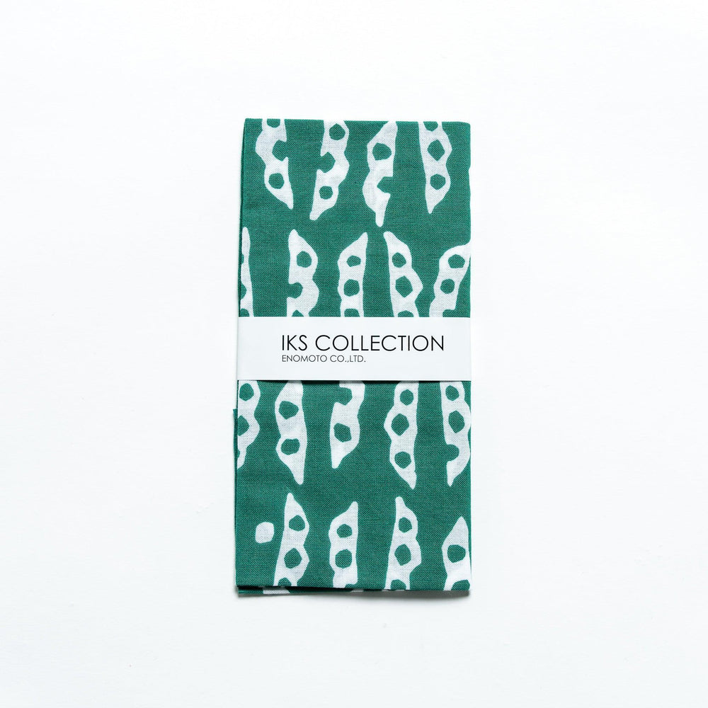 Folded green tenugui featuring edamame pod patterns, neatly wrapped with a product sleeve