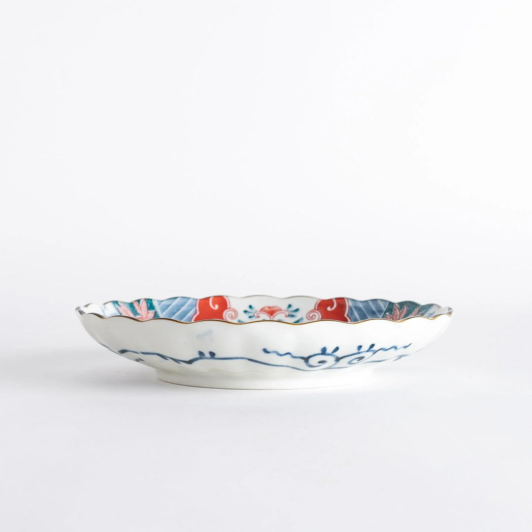 Profile view of the decorative plate, showing its depth and the vibrant colors of the design.