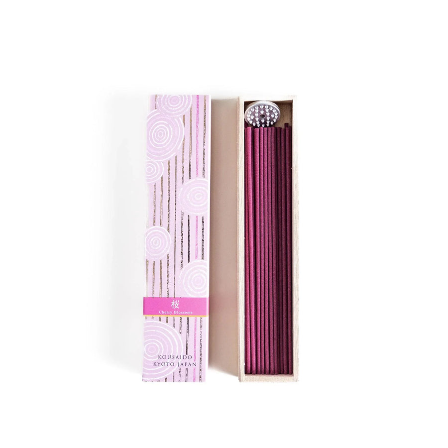Cherry blossom incense sticks in a pink box with holder, offering a gentle floral fragrance inspired by Japanese spring