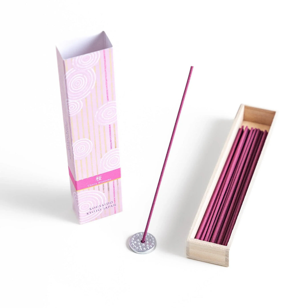 Cherry blossom incense sticks in a pink box with holder, offering a gentle floral fragrance inspired by Japanese spring