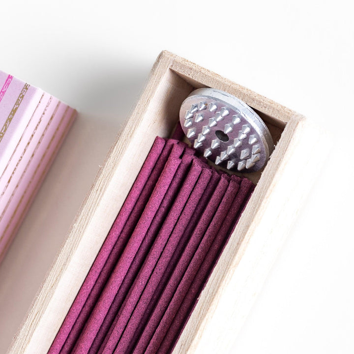 Cherry blossom incense sticks in a pink box with holder, offering a gentle floral fragrance inspired by Japanese spring