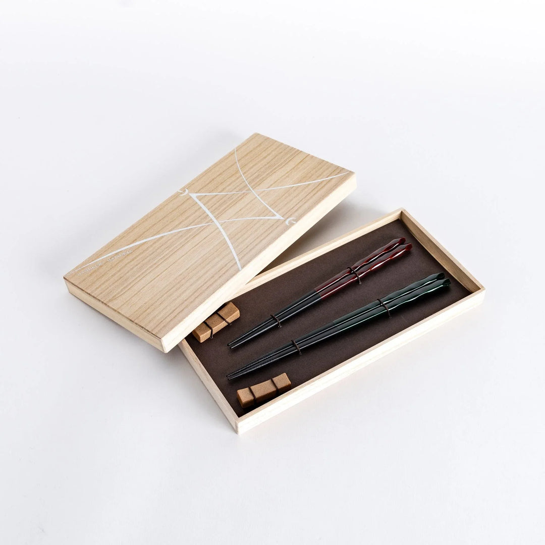 Ember and Forest carved chopsticks set in wooden box showcasing intricate design and elegant finish.
