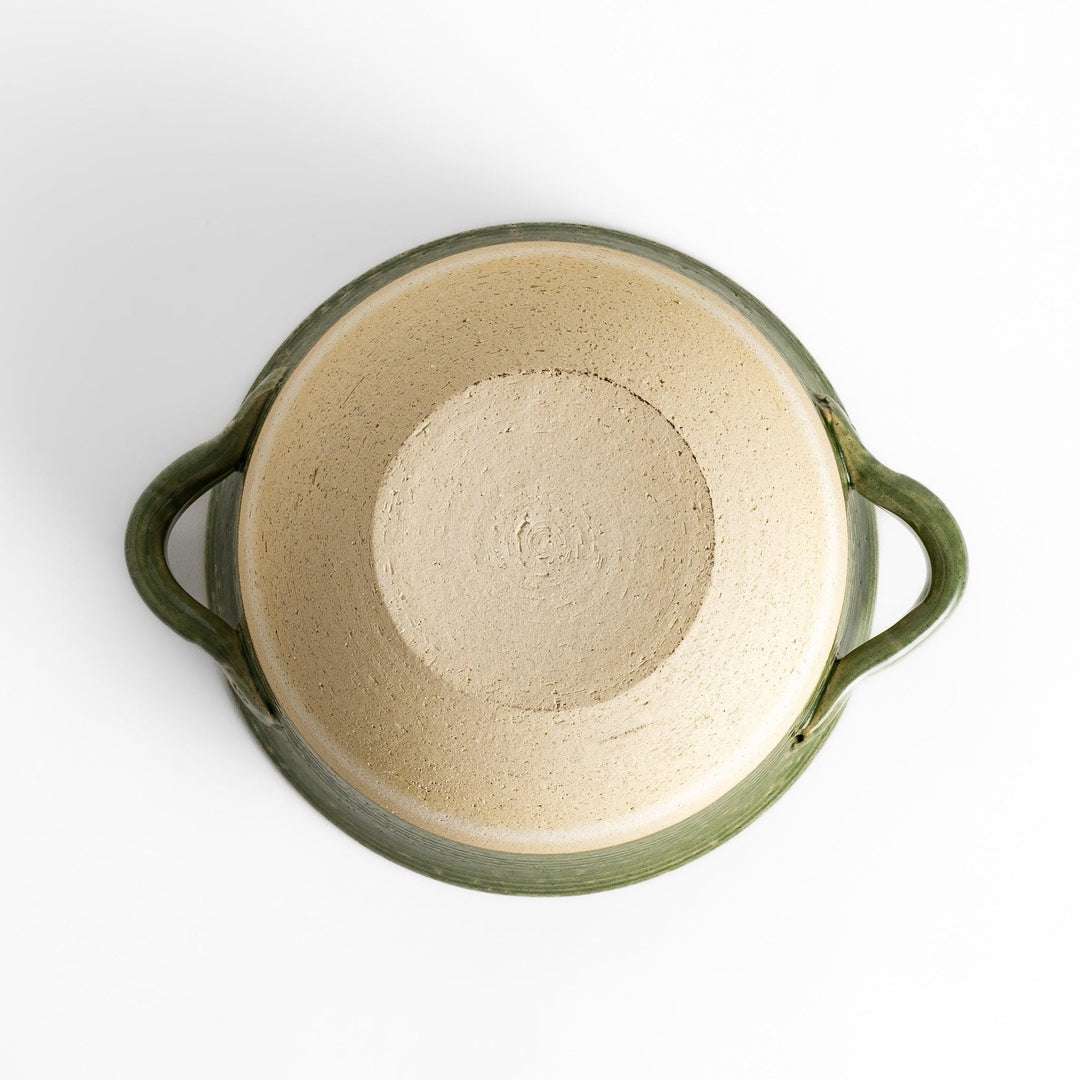 Emerald rice donabe clay pot with green glaze and round lid ideal for cooking flavorful Japanese rice.