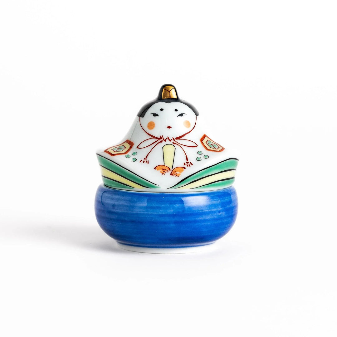 Ceramic condiment bowl with Japanese doll design perfect for serving sauces spices or small snacks.