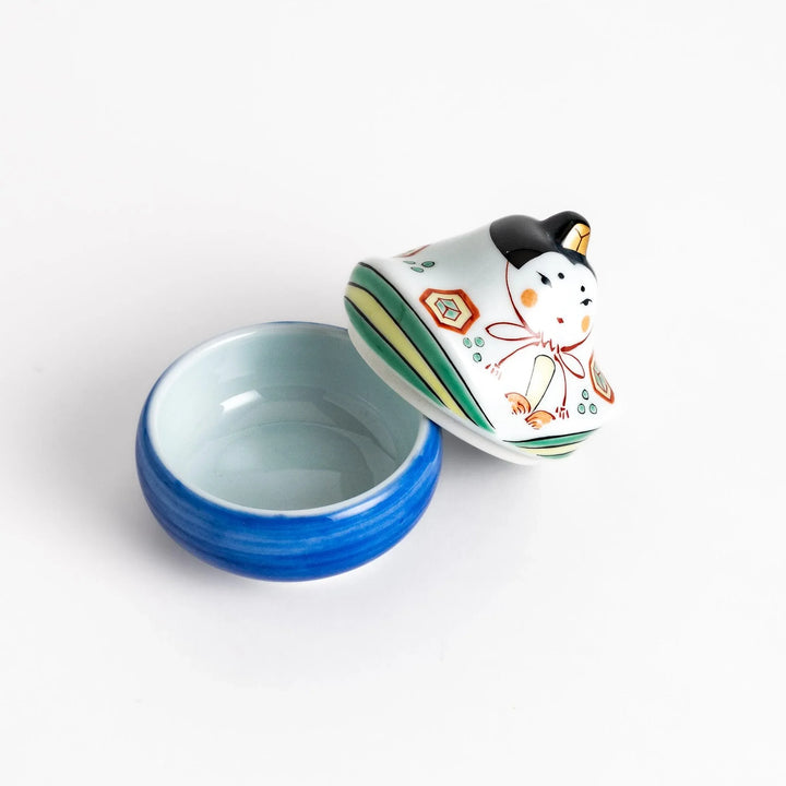 Ceramic condiment bowl with Japanese doll design perfect for serving sauces spices or small snacks.