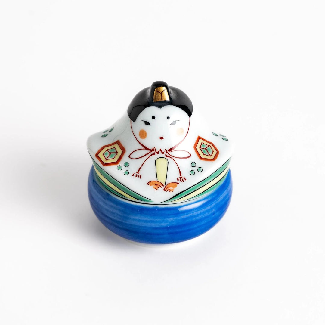 Ceramic condiment bowl with Japanese doll design perfect for serving sauces spices or small snacks.
