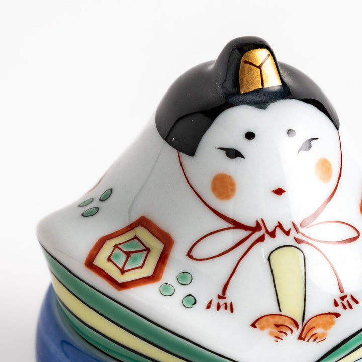 Ceramic condiment bowl with Japanese doll design perfect for serving sauces spices or small snacks.