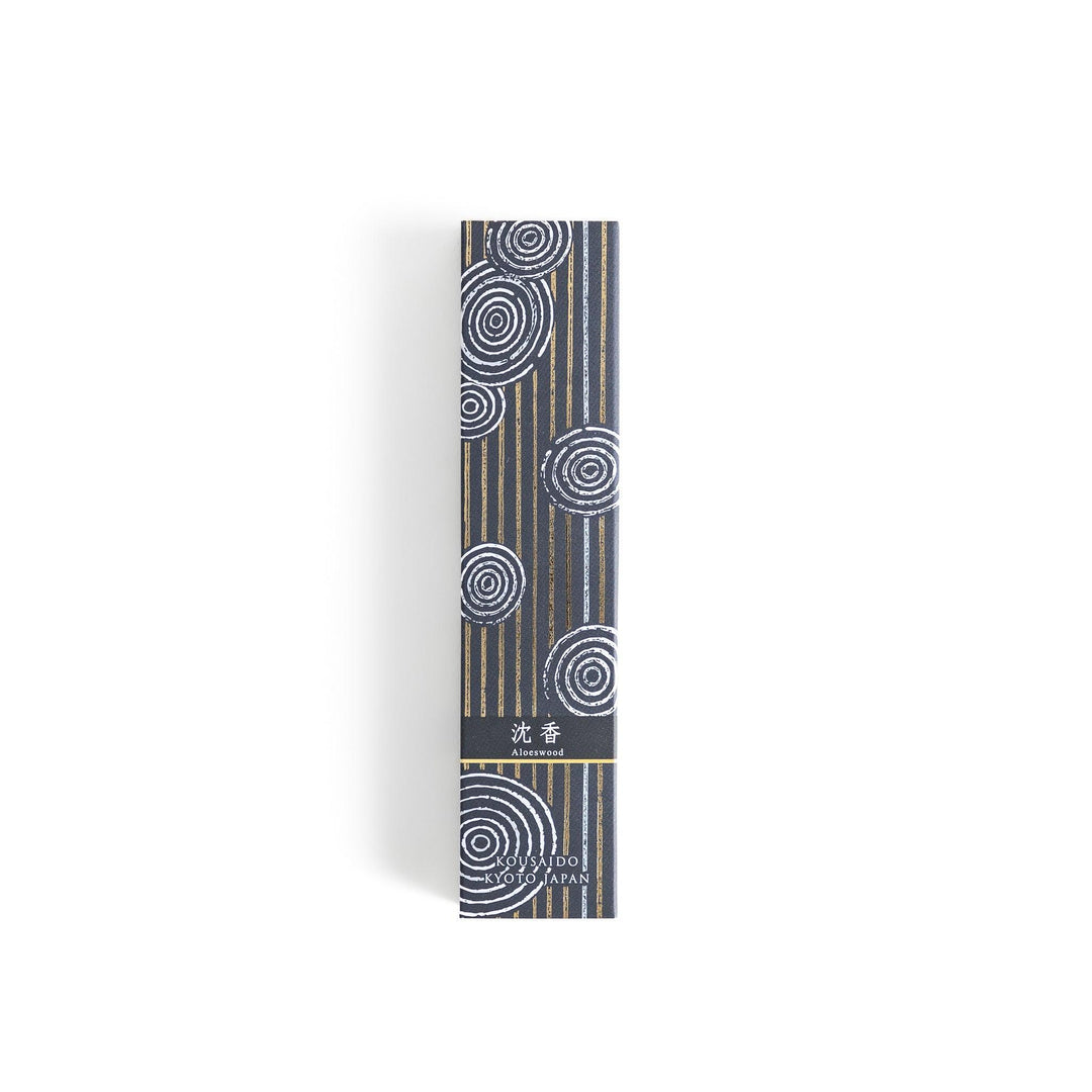 Japanese agarwood incense sticks in a wooden box with an elegant dark patterned sleeve from Kyoto’s Kousaido