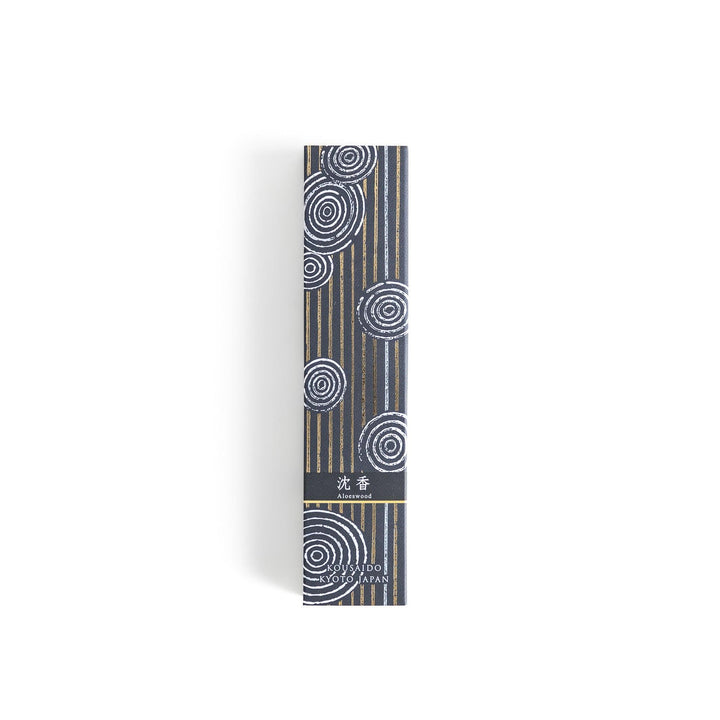 Japanese agarwood incense sticks in a wooden box with an elegant dark patterned sleeve from Kyoto’s Kousaido