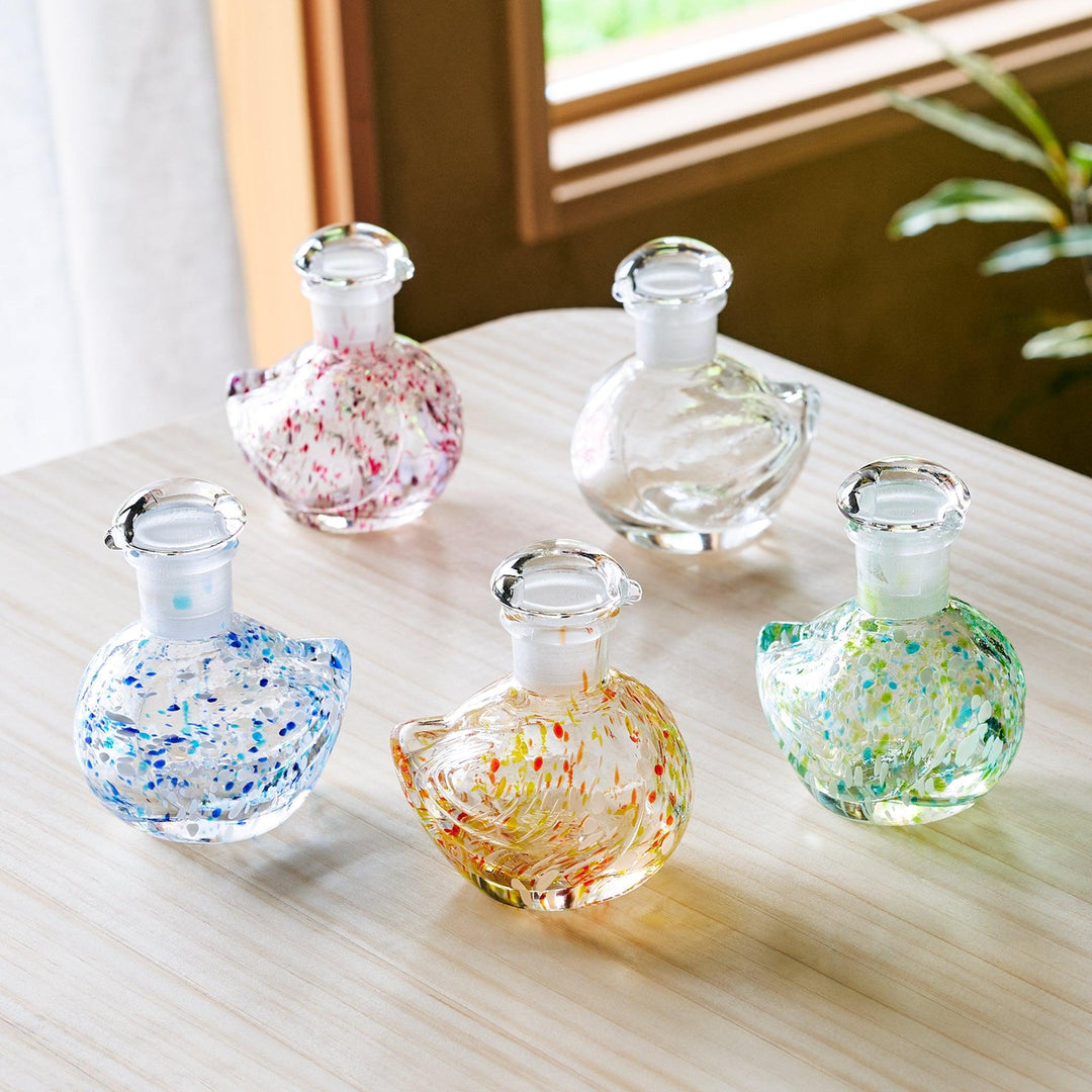 Glass soy sauce dispensers shaped like songbirds, each featuring colorful patterns and a fitted glass stopper.