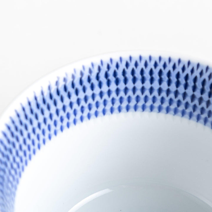 Japanese porcelain dessert bowl with delicate vertical line pattern and smooth gradient design for modern, everyday dining
