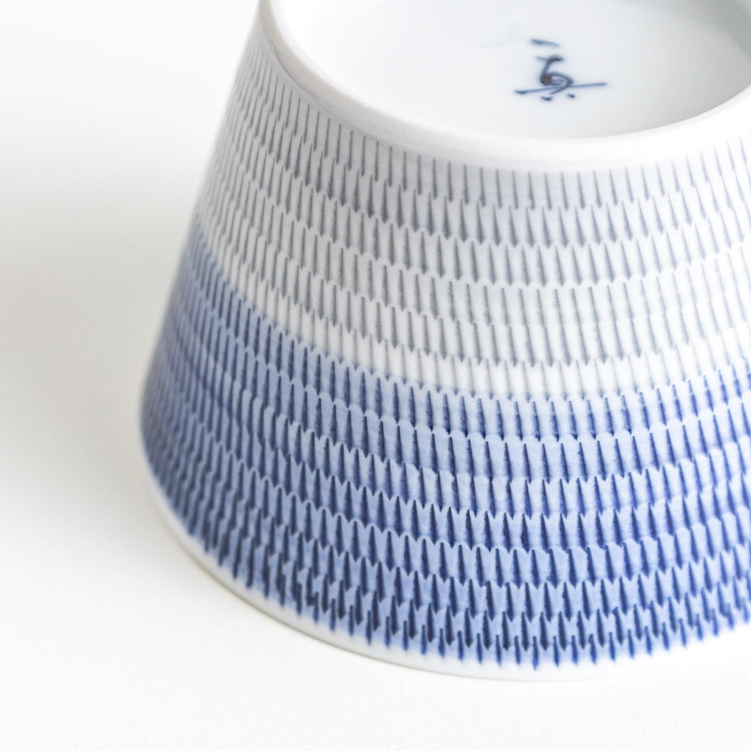 Japanese porcelain dessert bowl with delicate vertical line pattern and smooth gradient design for modern, everyday dining