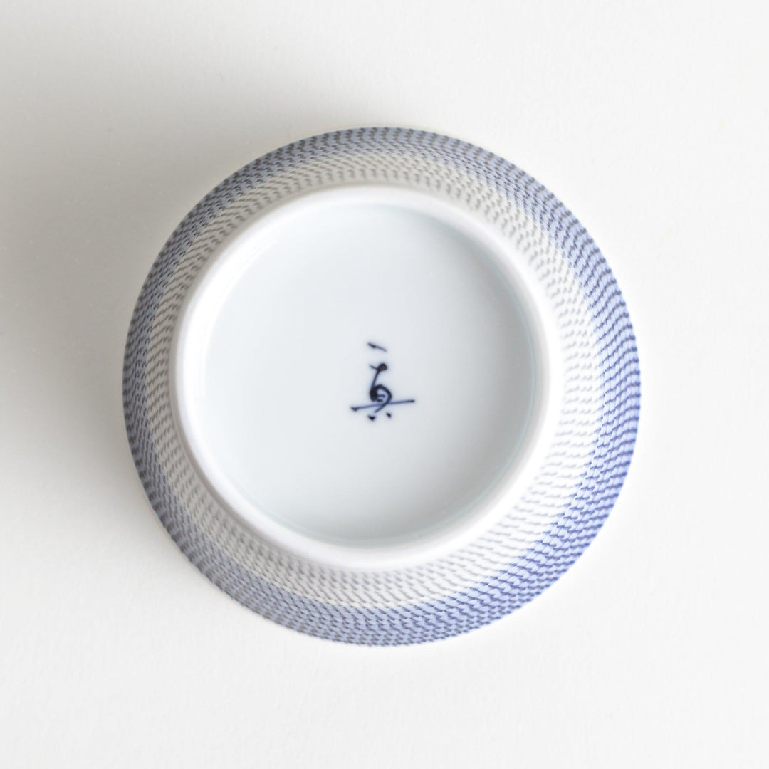 Japanese porcelain dessert bowl with delicate vertical line pattern and smooth gradient design for modern, everyday dining
