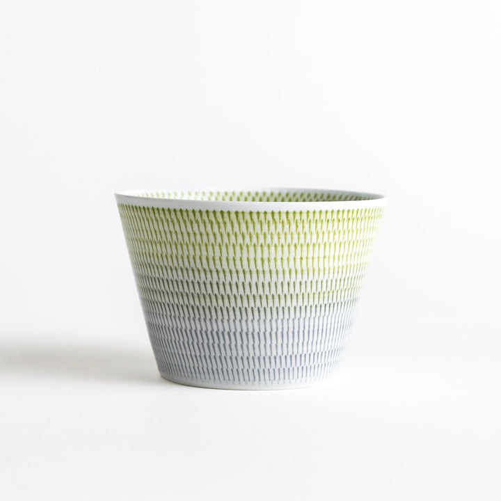 Japanese porcelain dessert bowl with delicate vertical line pattern and smooth gradient design for modern, everyday dining