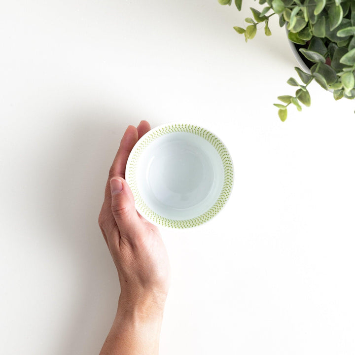 Japanese porcelain dessert bowl with delicate vertical line pattern and smooth gradient design for modern, everyday dining