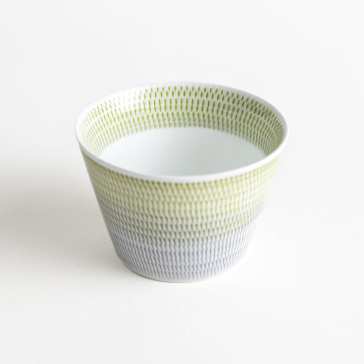 Japanese porcelain dessert bowl with delicate vertical line pattern and smooth gradient design for modern, everyday dining