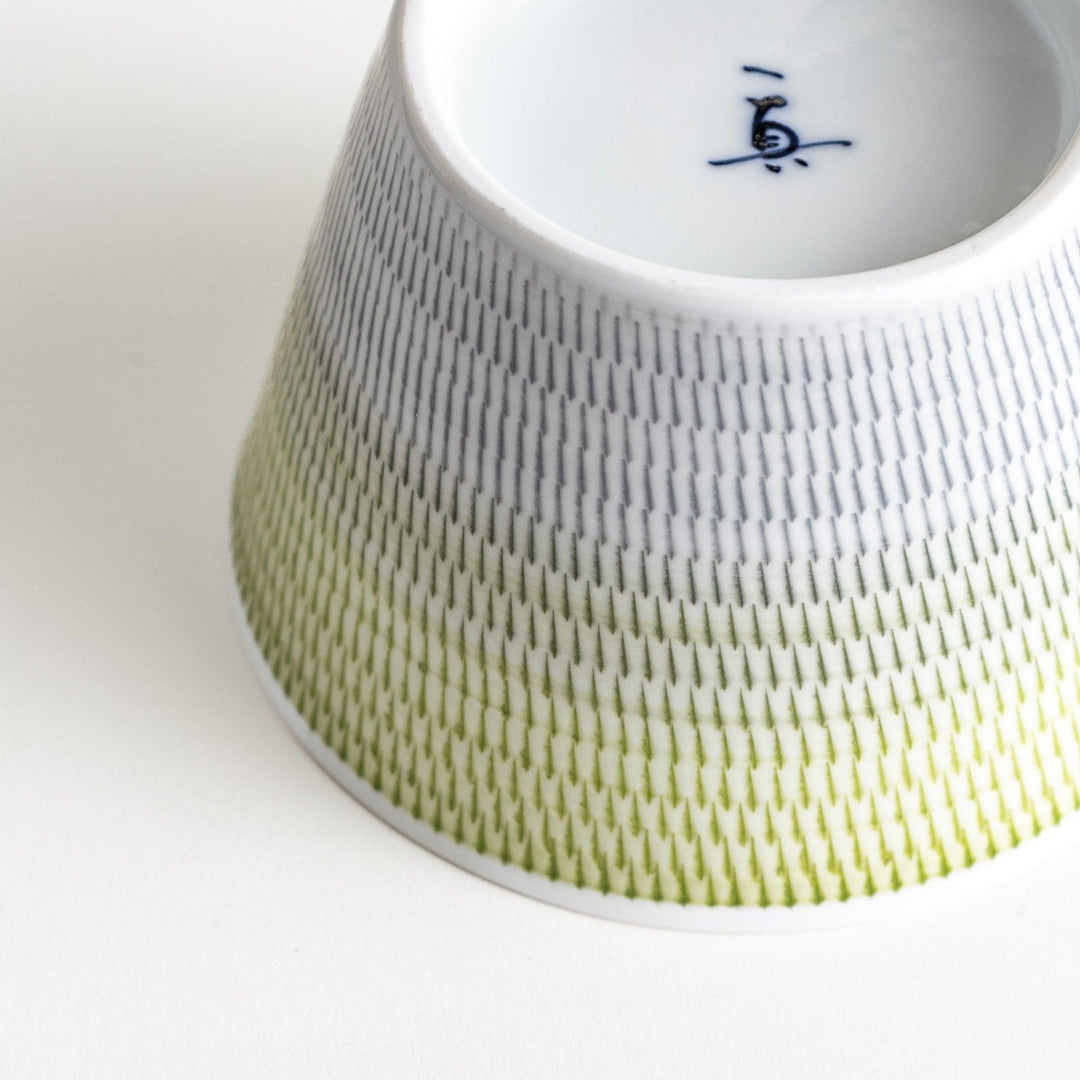 Japanese porcelain dessert bowl with delicate vertical line pattern and smooth gradient design for modern, everyday dining