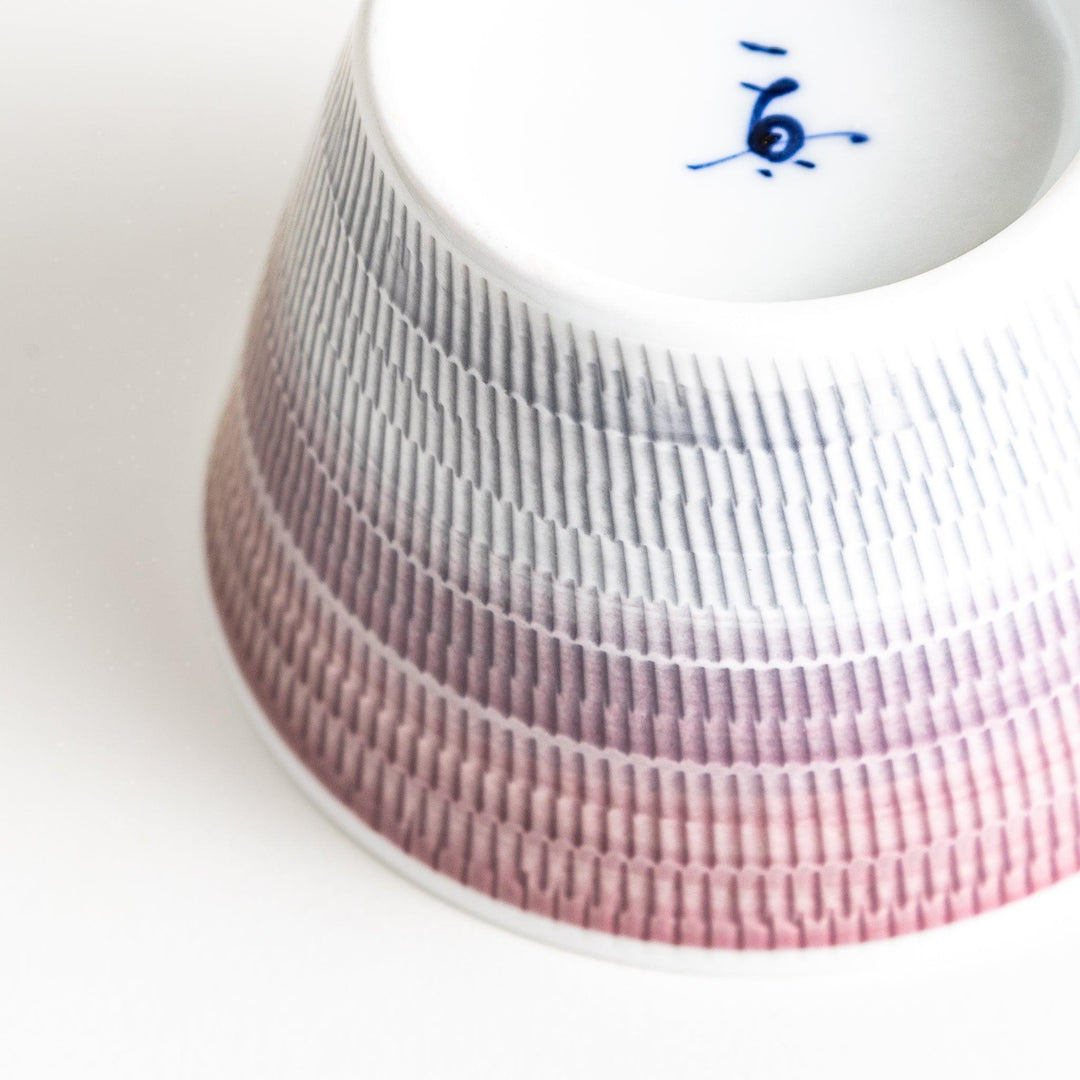 Japanese porcelain dessert bowl with delicate vertical line pattern and smooth gradient design for modern, everyday dining