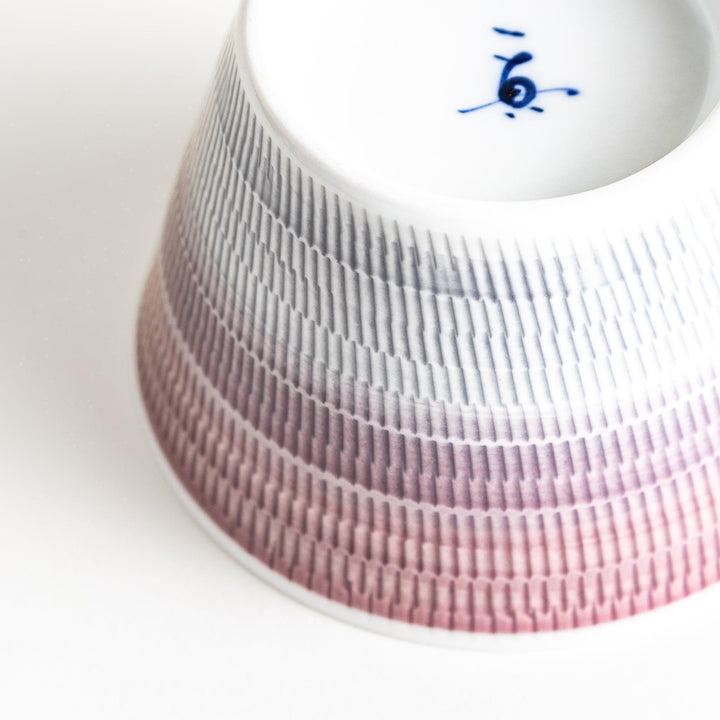 Japanese porcelain dessert bowl with delicate vertical line pattern and smooth gradient design for modern, everyday dining