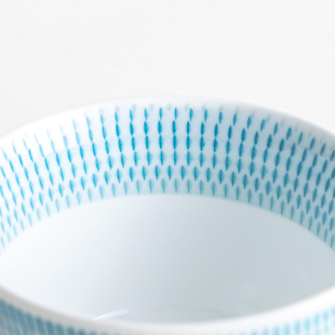 Japanese porcelain dessert bowl with delicate vertical line pattern and smooth gradient design for modern, everyday dining